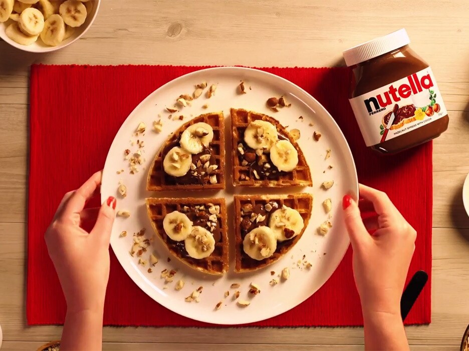 Waffles with NUTELLA®, banana and crushed hazelnuts